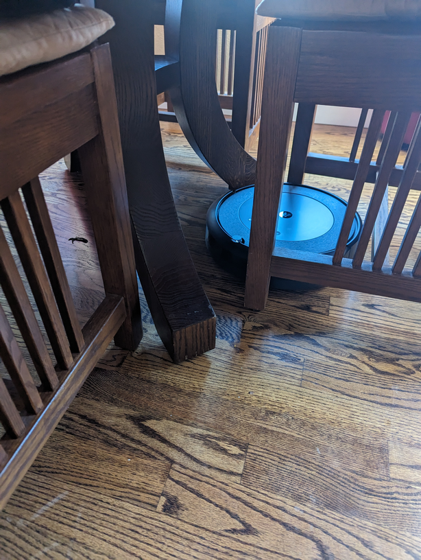 roomba trapped under chair legs