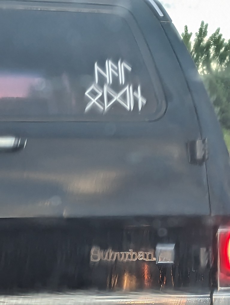 bumper sticker on Chevy suburban